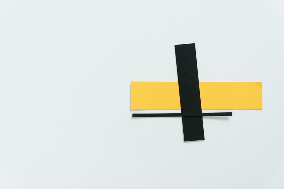 Black and yellow paper strips on a white proof desk